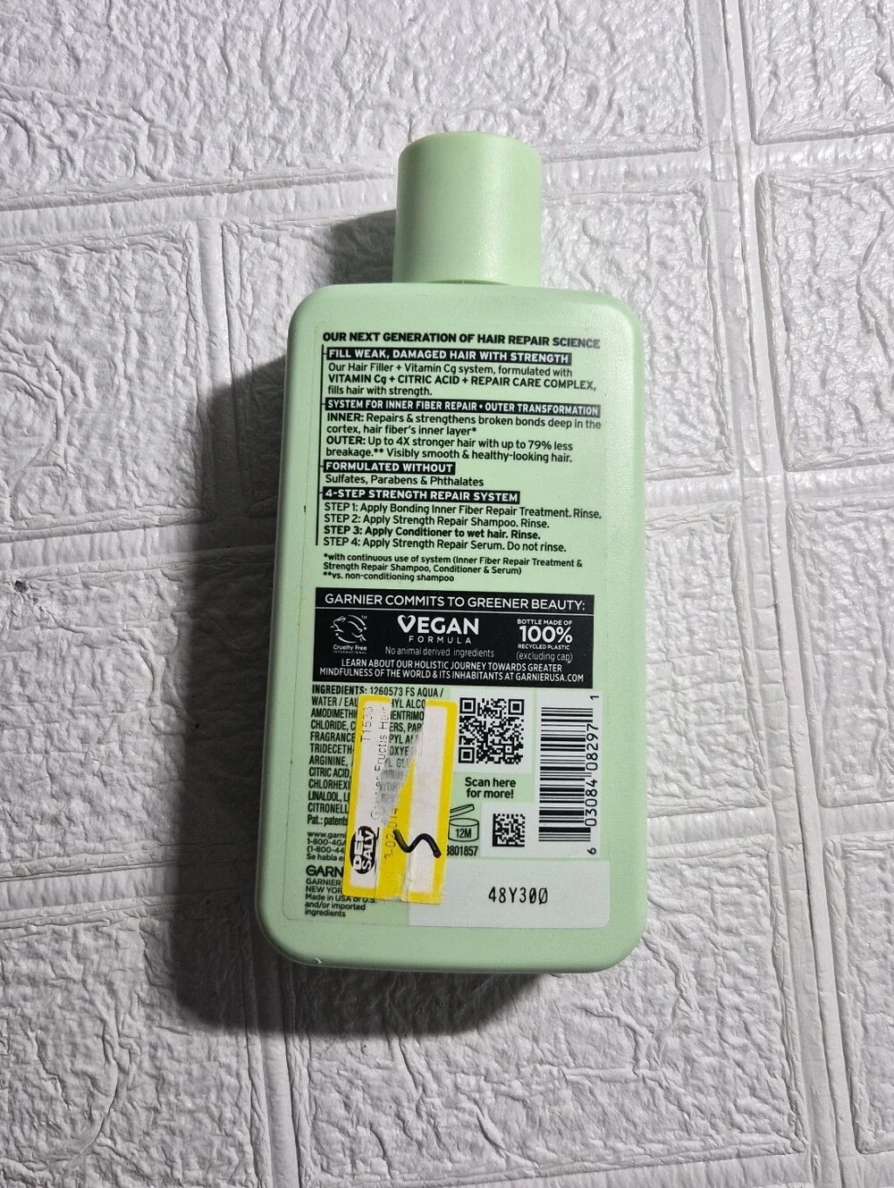 10.1 fl oz bottle of Garnier Fructis Hair Filler Strength Repair Conditioner,